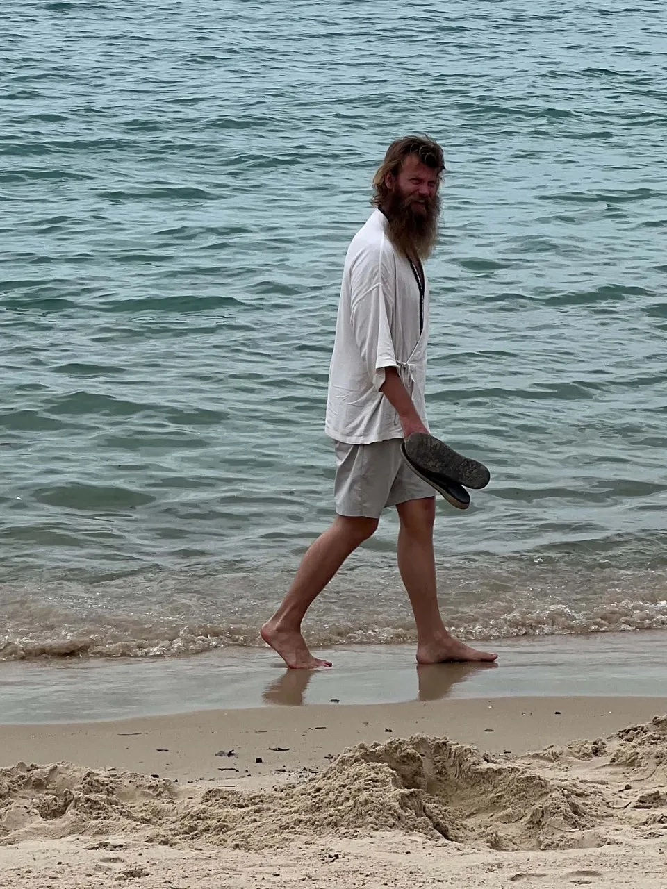 Rick walking along the shore